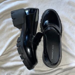 Black Dylan Sincerely Jane platform shoes.